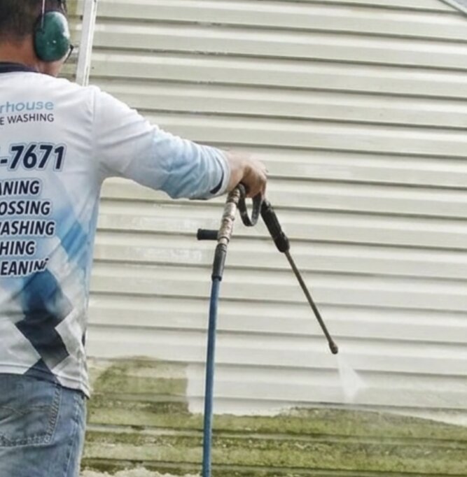 Detail soft-wash on the side of a Abbotsford home with eco-friendly chemicals being applied